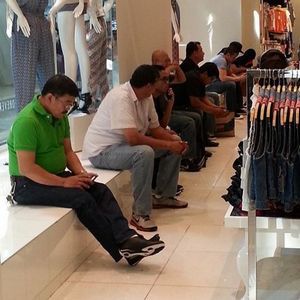 Men waiting outside dressing room - 5